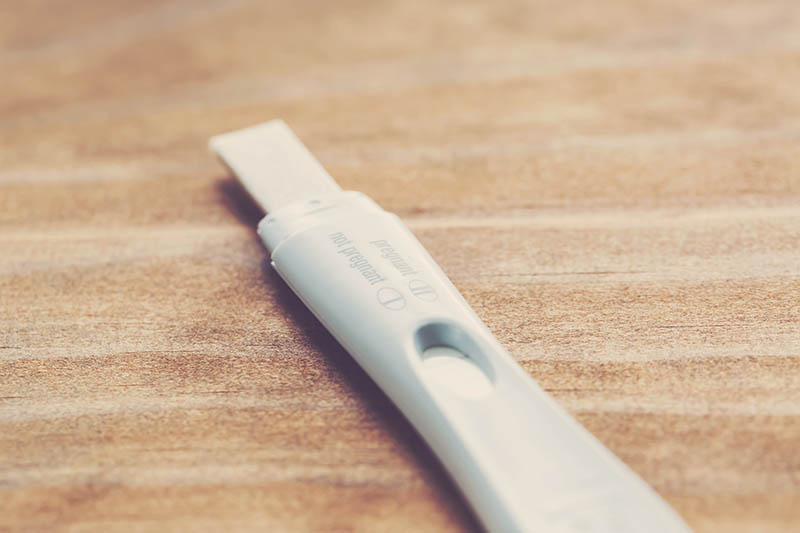Pregnancy test Pregnancy test on a wooden surface