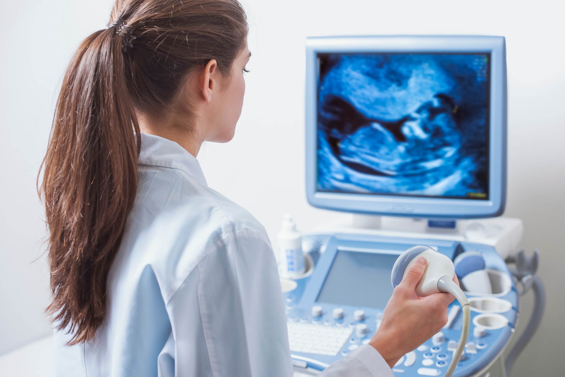 Ultrasound care Female medical professional performing an ultrasound