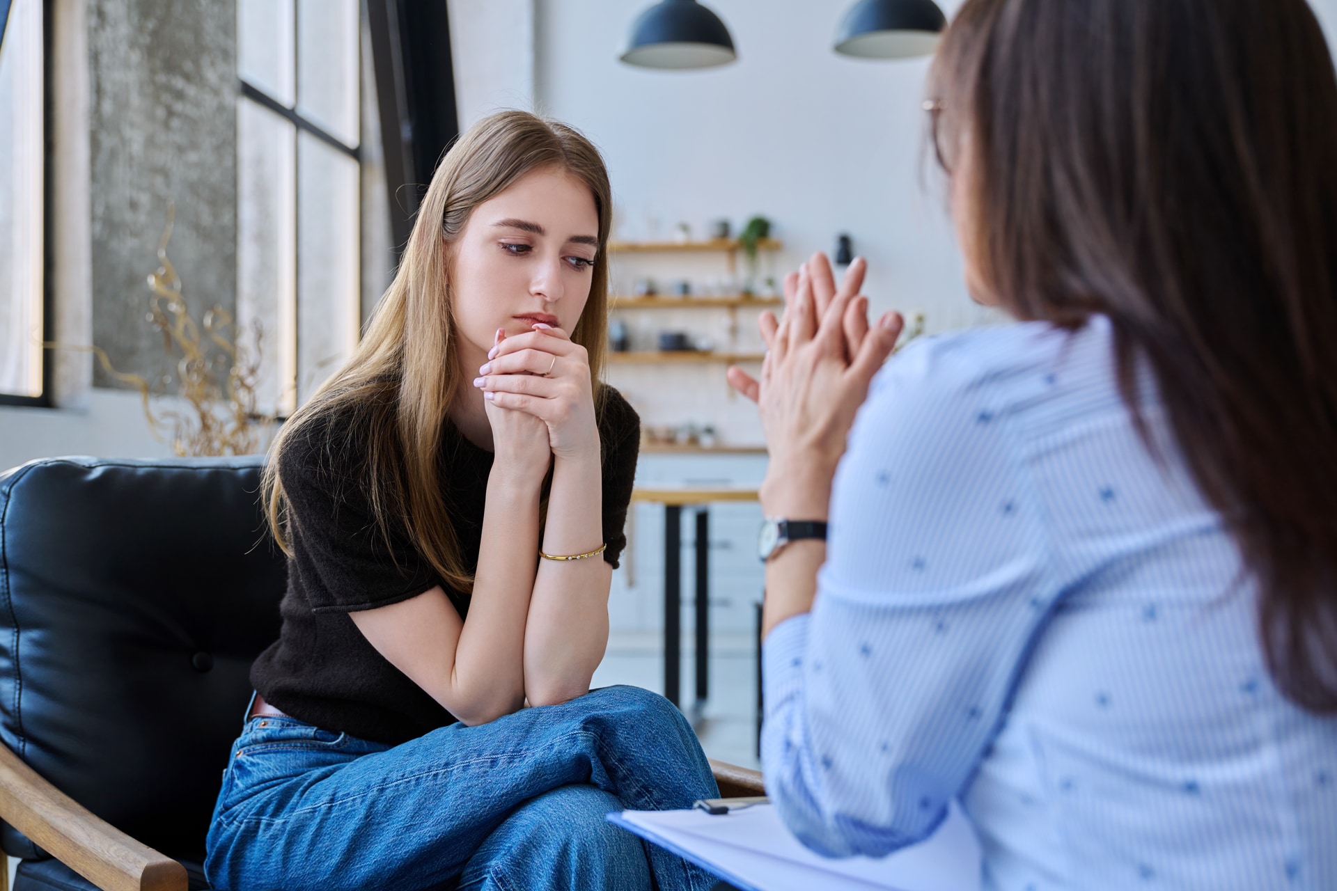 Pregnancy counseling Young woman listening during a counseling conversation
