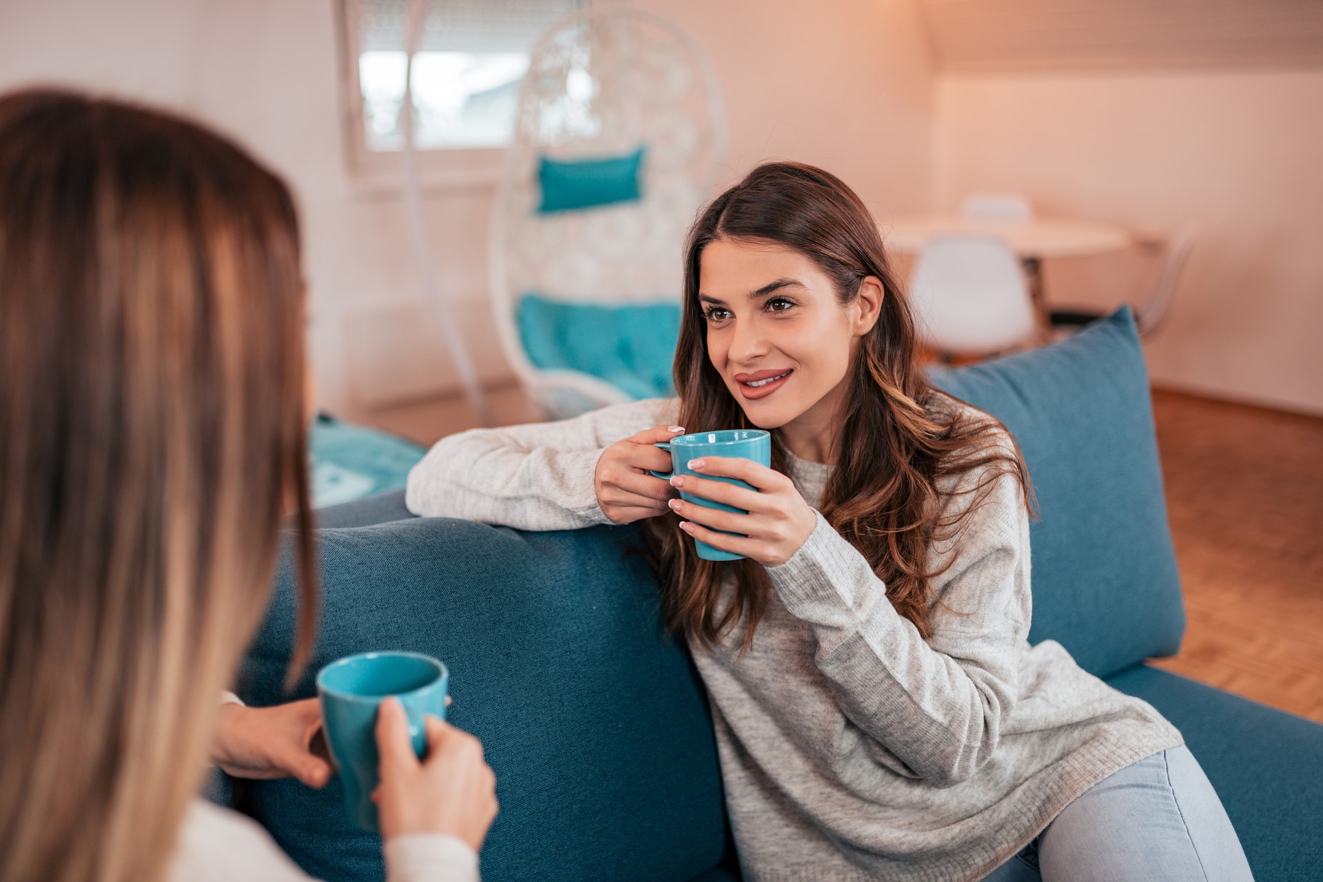 Community connection Two women talking over coffee in a welcoming setting
