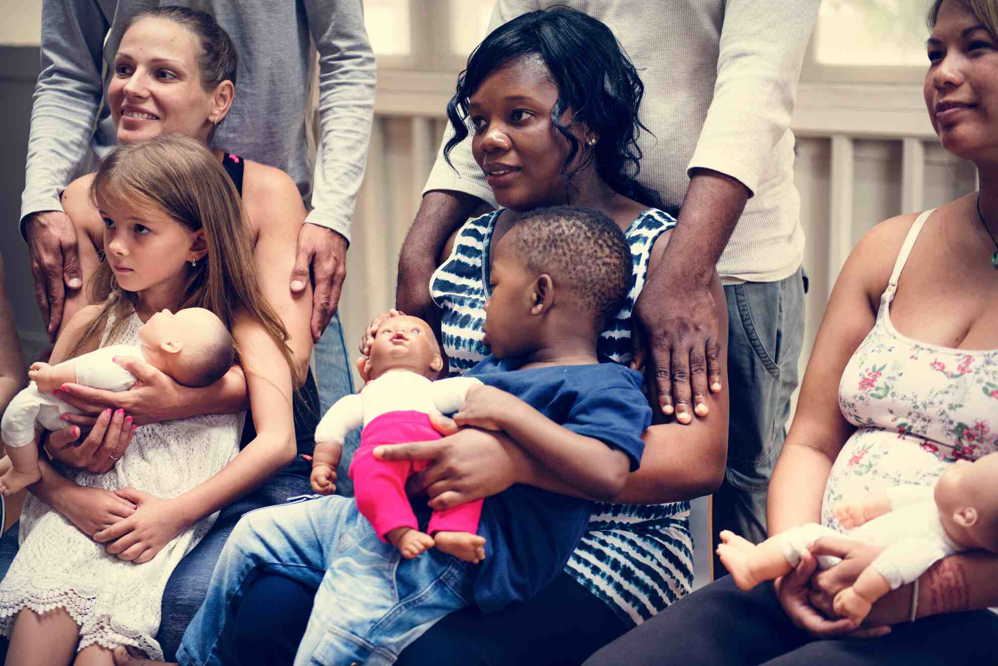Parenting class Adults learning infant care skills in a parenting class