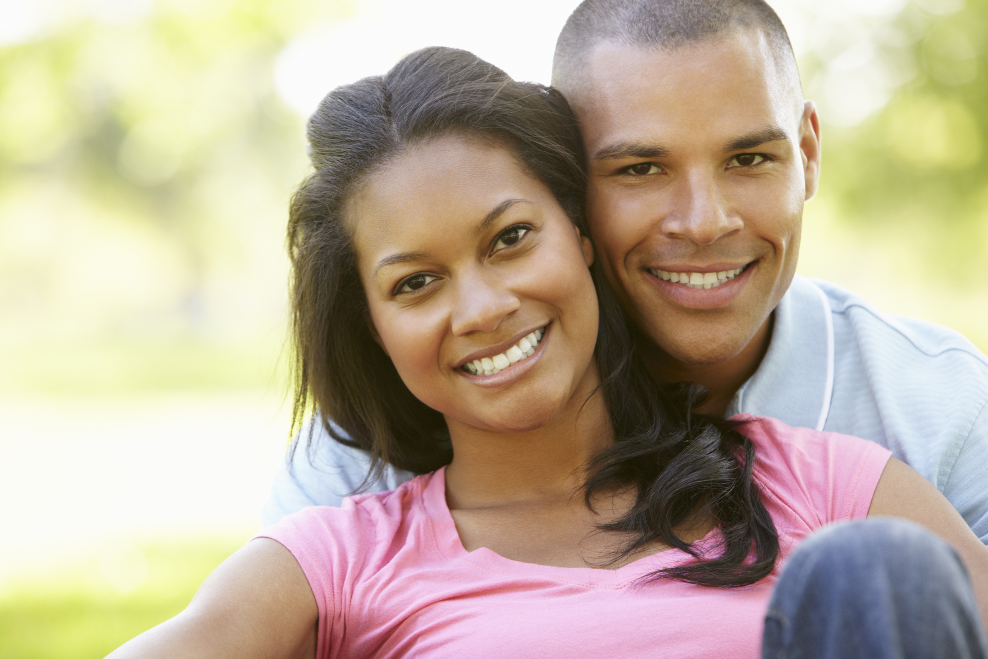Adoption information and referrals Hopeful couple smiling together outdoors